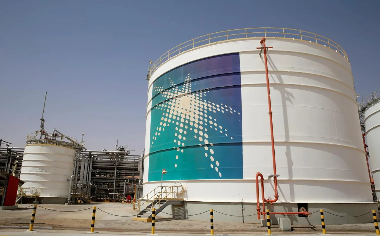 FILE PHOTO: An Aramco oil tank is seen at the Production facility at Saudi Aramco's Shaybah oilfield in the Empty Quarter, Saudi Arabia May 22, 2018 REUTERS/Ahmed Jadallah/File Photo