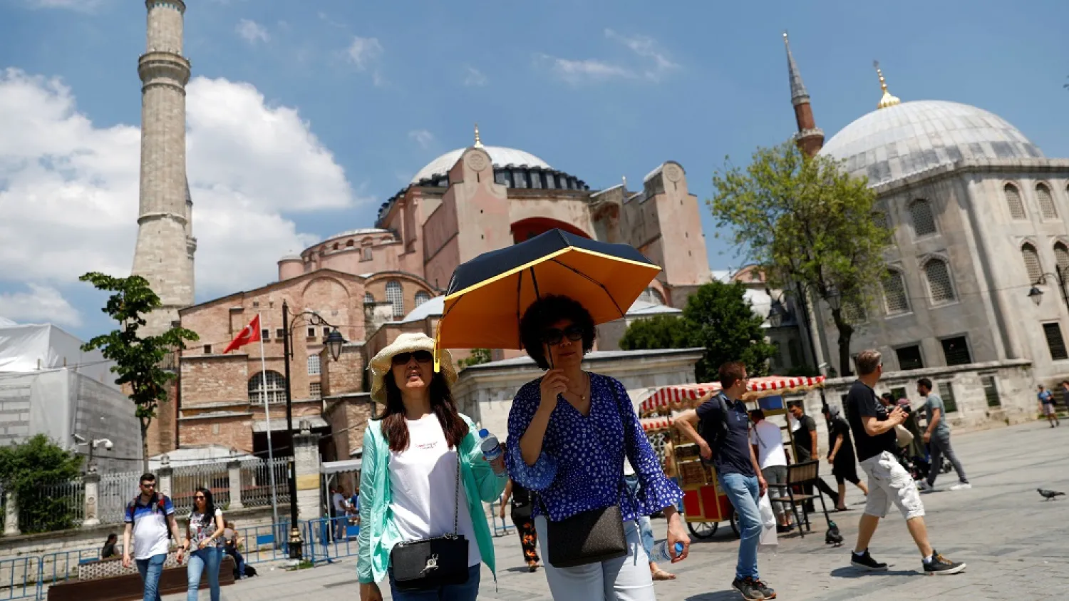 Tourists walk as they leave the Byzantine-era monument of Hagia Sophia, now a museum, in Istanbul, Turkey, May 31, 2019. (Reuters)