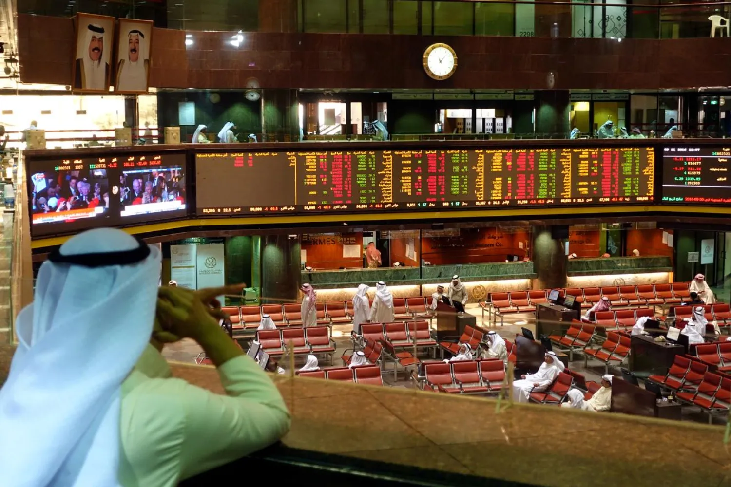 Traders monitor stock information at the Borsa Kuwait Stock Exchange, in Kuwait City, Kuwait November 9, 2016. REUTERS/Stephanie McGehee/File Photo