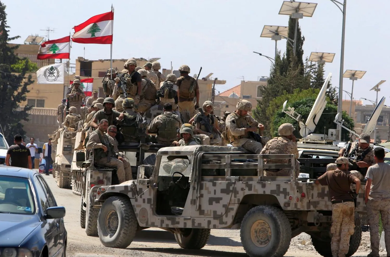 Lebanese army soldiers are seen on their military vehicles in the town of Ras Baalbek, Lebanon August 21, 2017. (Reuters)