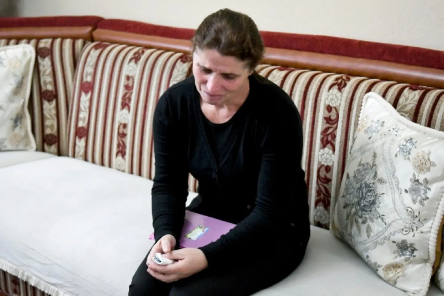 Mide Dumani has not seen her two children since her husband ferried them off to Syria in February 2014 | AFP