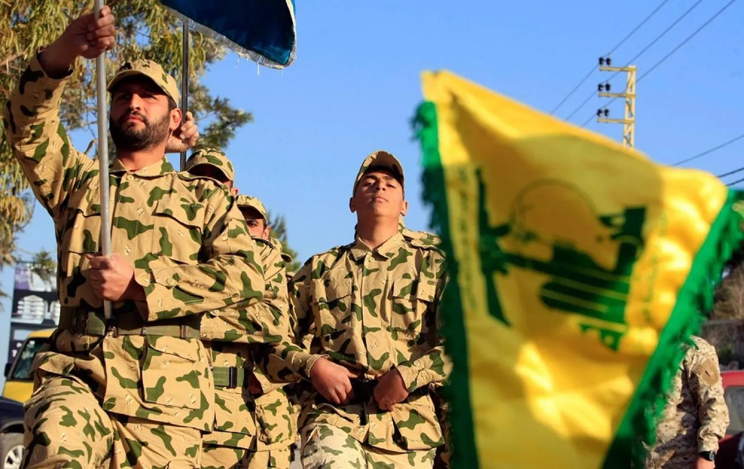 Hezbollah fighters parade during a ceremony to honor fallen comrades, in Tefahta village, south Lebanon, February 18, 2017. (AP)