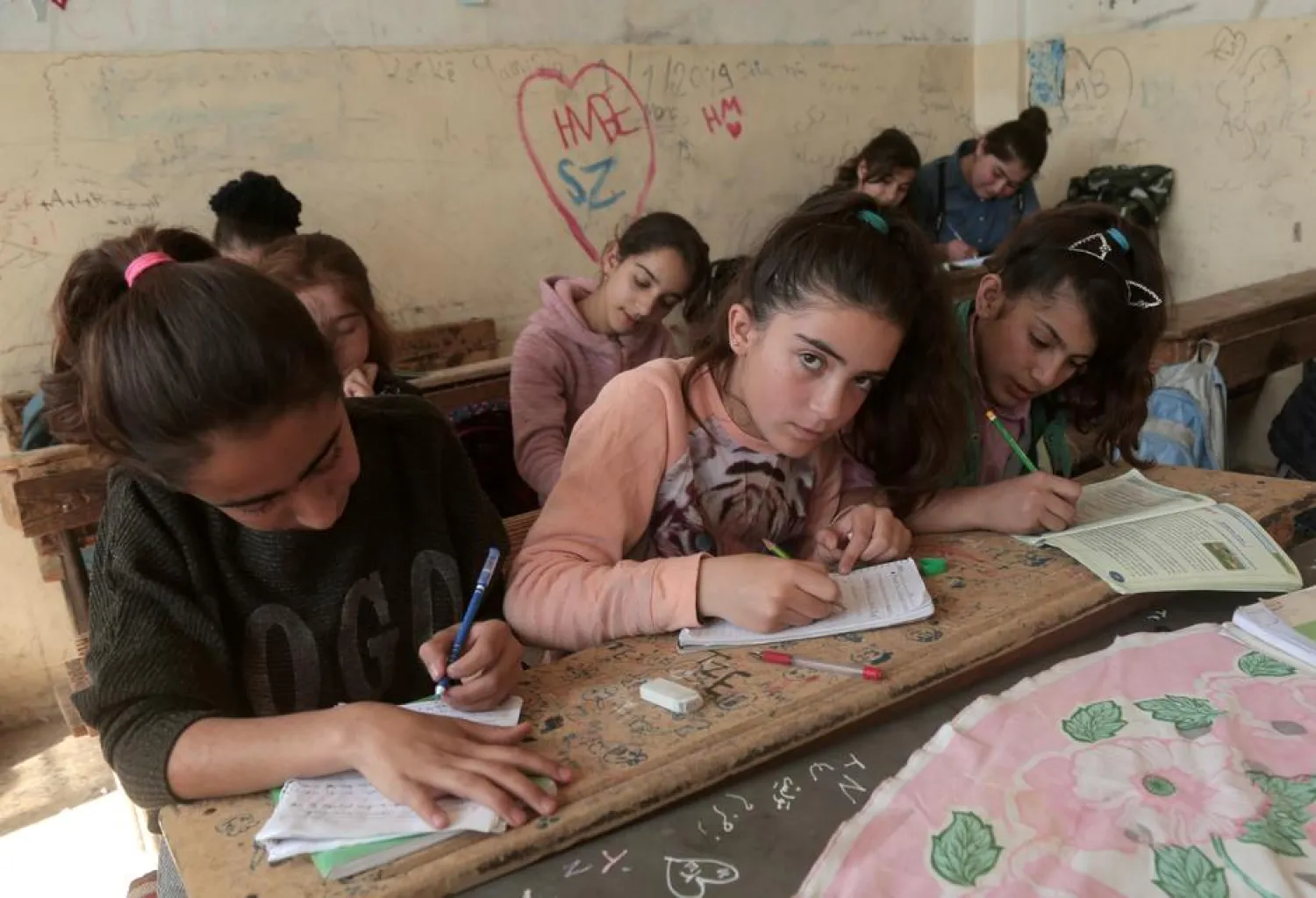 Kurdish students attend class at a school in Qamishli, Syria, March 11, 2019. (Reuters)