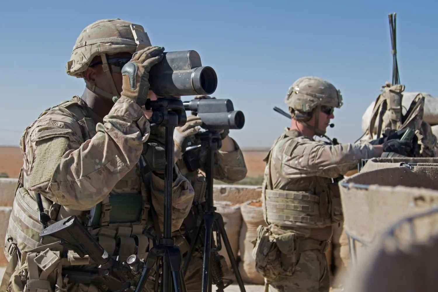 FILE PHOTO: US soldiers surveil the area during a combined joint patrol in Manbij, Syria, November 1, 2018. Courtesy Zoe Garbarino/US Army/Handout via REUTERS /File Photo