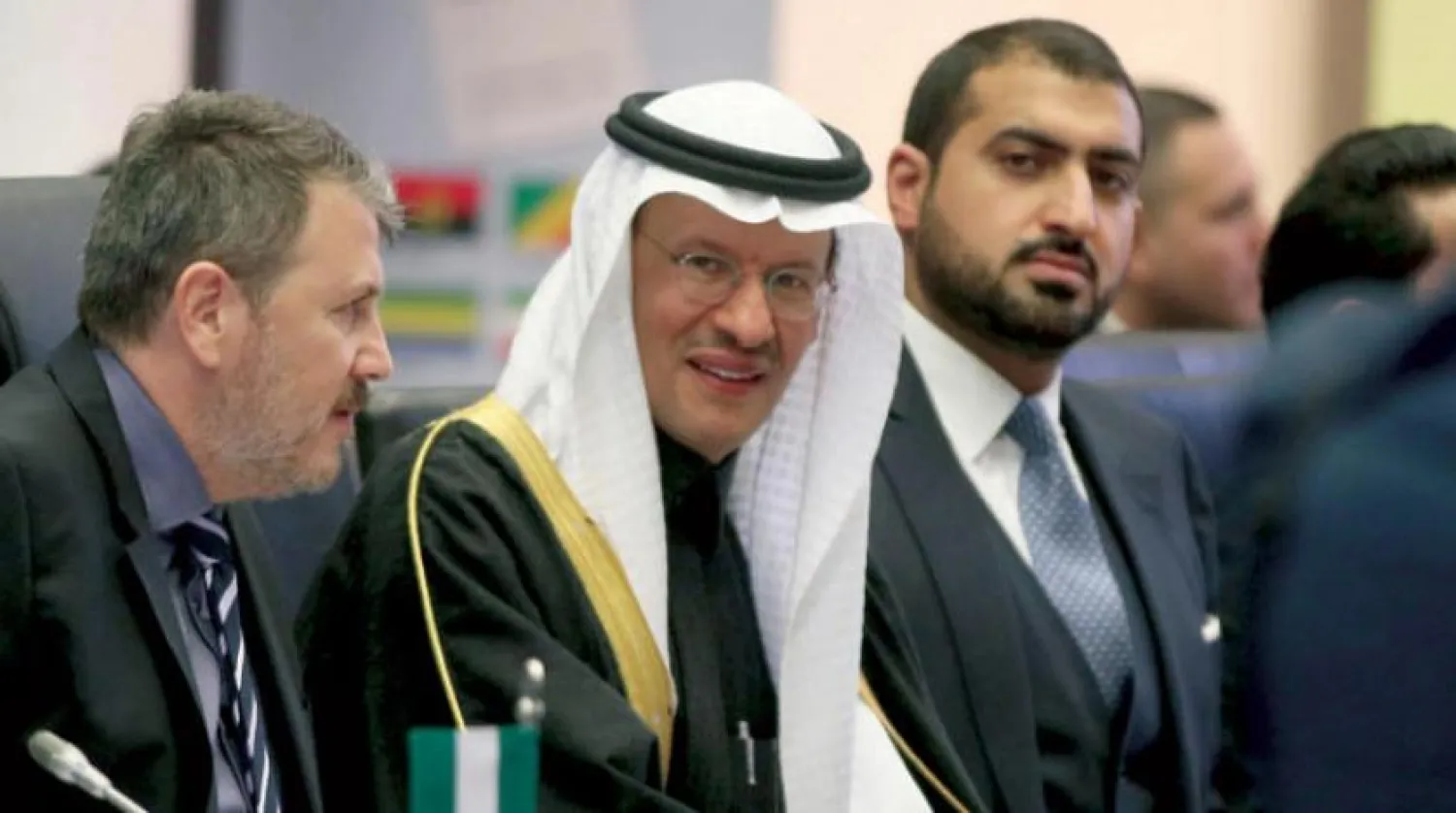 Prince Abdulaziz bin Salman, center, Minister of Energy of Saudi Arabia looks prior to the start of a meeting of the Organization of the Petroleum Exporting Countries, OPEC, at their headquarters in Vienna, Austria, Thursday, Dec. 5, 2019. (AP Photo/Ronald Zak)