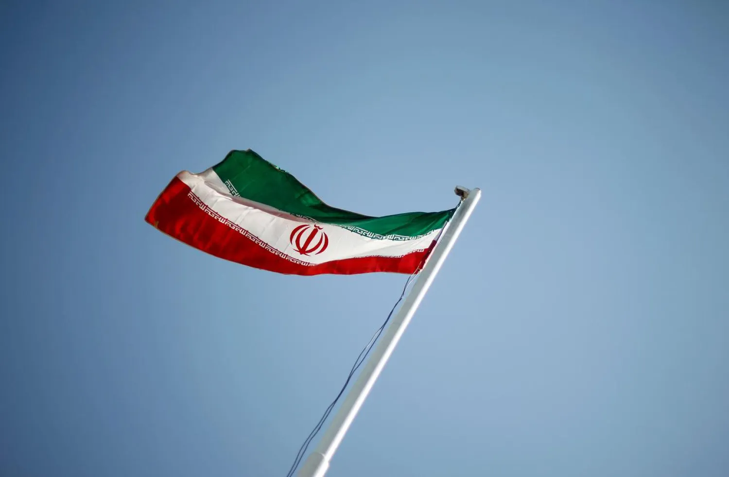 An Iranian national flag flutters during the opening ceremony of the 16th International Oil, Gas & Petrochemical Exhibition (IOGPE) in Tehran April 15, 2011. (Reuters)
