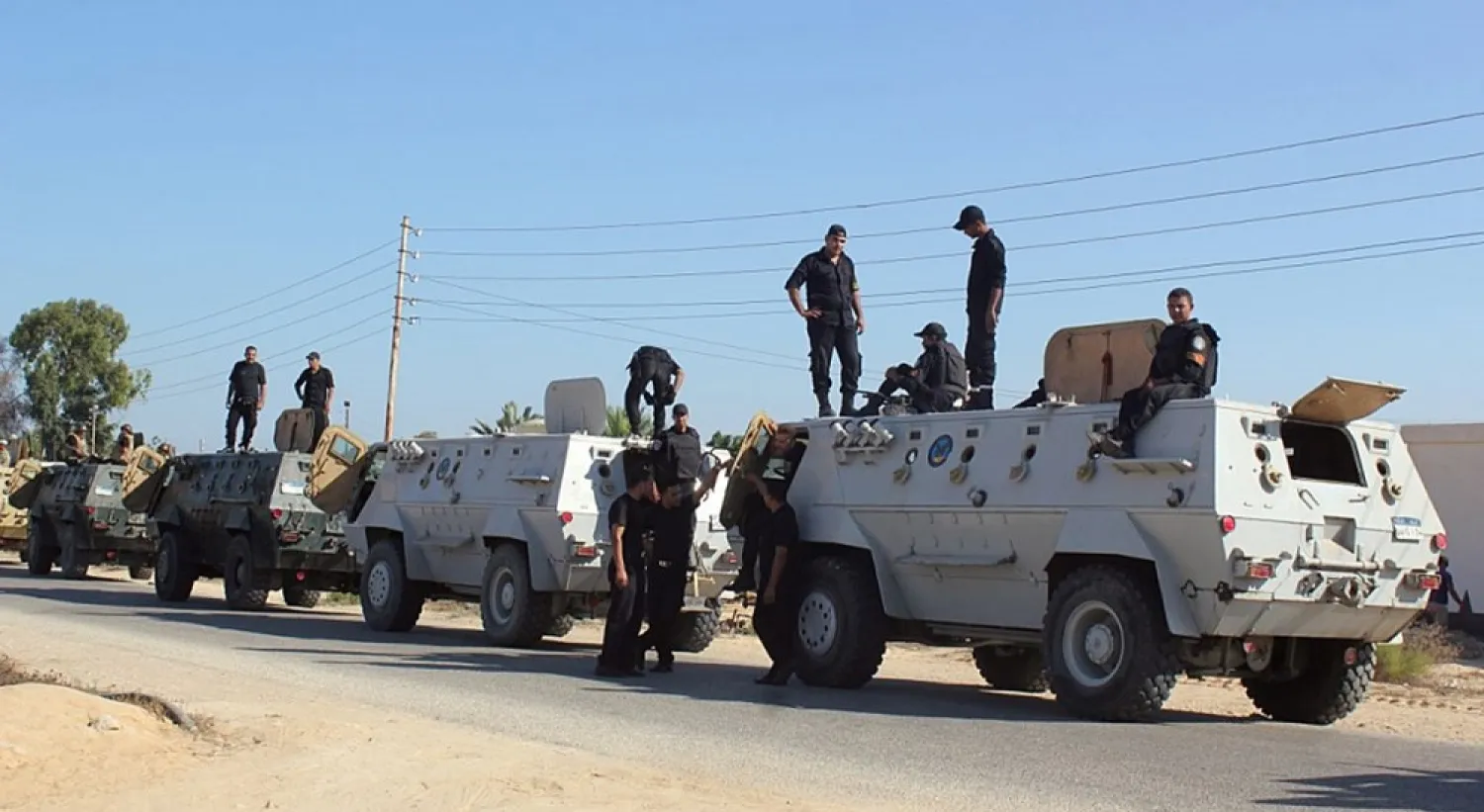 Egyptian security forces stand by their armored personnel carriers ahead of a military operation in the northern Sinai Peninsula. (AFP file photo)