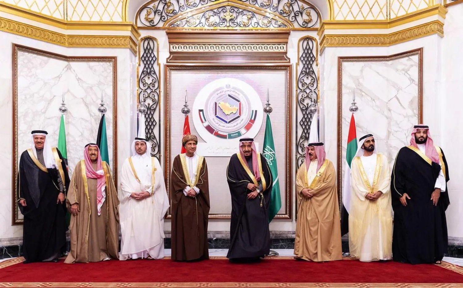 A handout picture provided by the Saudi Royal Palace shows (L to R) Secretary-General of the GCC Abdullatif bin Rashid Al-Zayani, Kuwaiti Emir Sheikh Sabah Al-Ahmad Al-Jaber Al-Sabah, Qatar's Prime Minister Abdullah bin Nasser bin Khalifa al-Thani, Omani Deputy Prime Minister Fahd bin Mahmud al-Said, Saudi King Salman bin Abdulaziz, Bahrain's King Hamad bin Isa Al Khalifa, Vice President and Prime Minister of the United Arab Emirates, and ruler of the Emirate of Dubai Mohammed bin Rashid Al-Maktoum and Saudi Crown Prince Mohammed bin Salman, attending the 40th Gulf Cooperation Council (GCC) summit held at the Saudi capital Riyadh on December 10, 2019. AFP PHOTO / SAUDI ROYAL PALACE / BANDAR AL-JALOUD