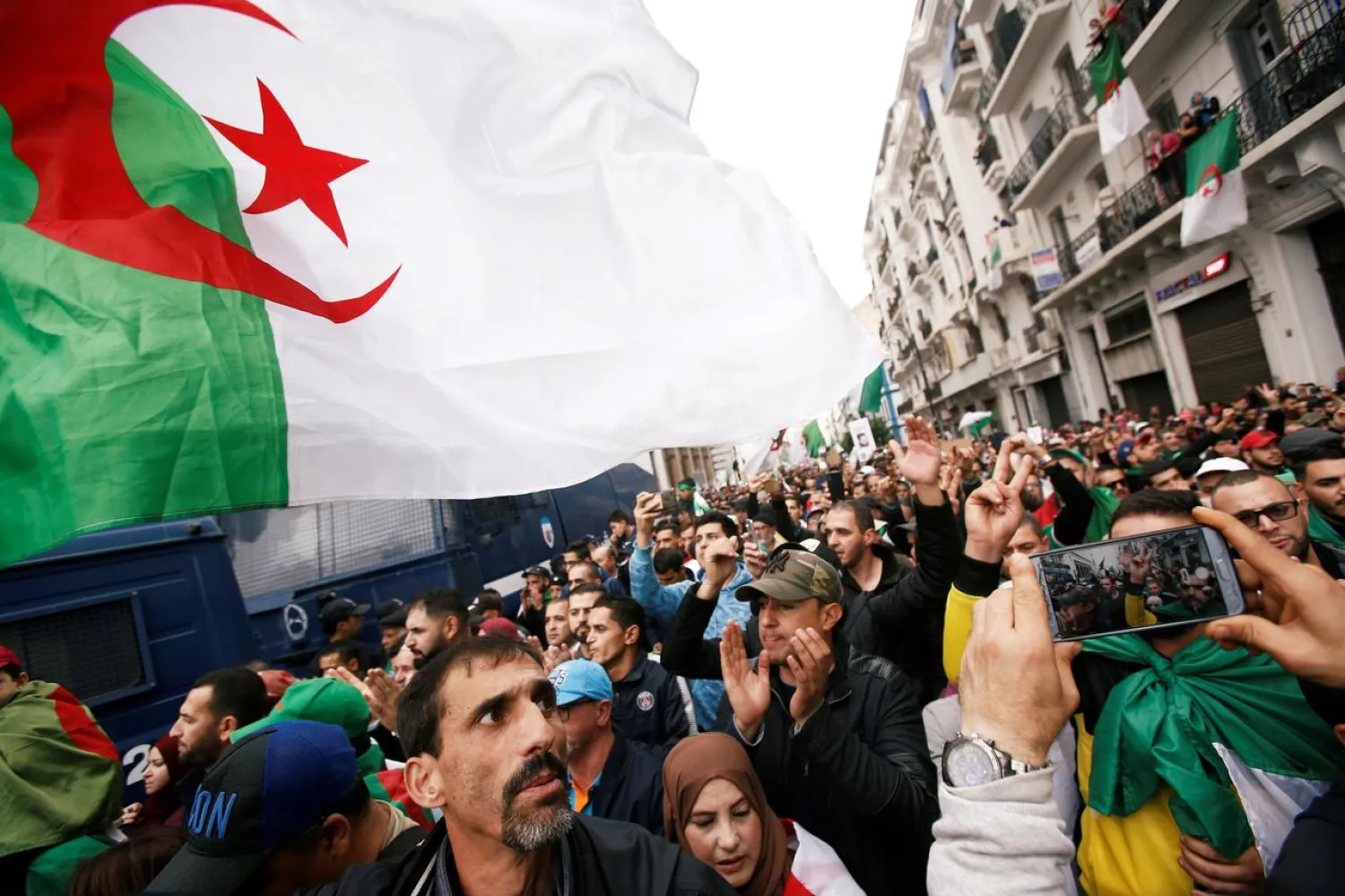 Demonstrators carry national flags and gesture during a protest rejecting the December presidential election in Algiers, Algeria November 22, 2019. (Reuters)
