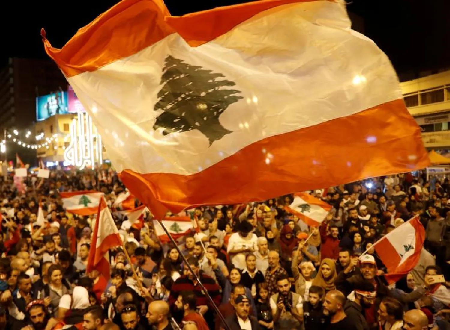 Demonstrators wave Lebanese flags during a protest in Tripoli, Lebanon, November 2, 2019. REUTERS/Goran Tomasevic/File Photo