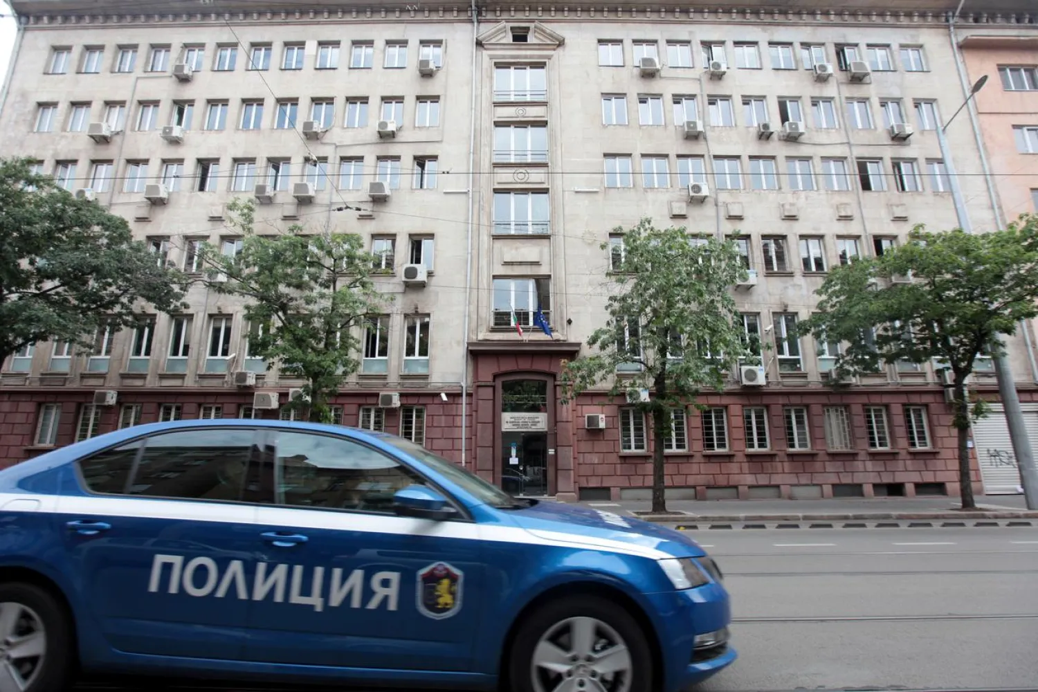 A police car passes past Bulgaria's National Revenue Agency building in Sofia, Bulgaria, July 16, 2019. REUTERS/Dimitar Kyosemarliev