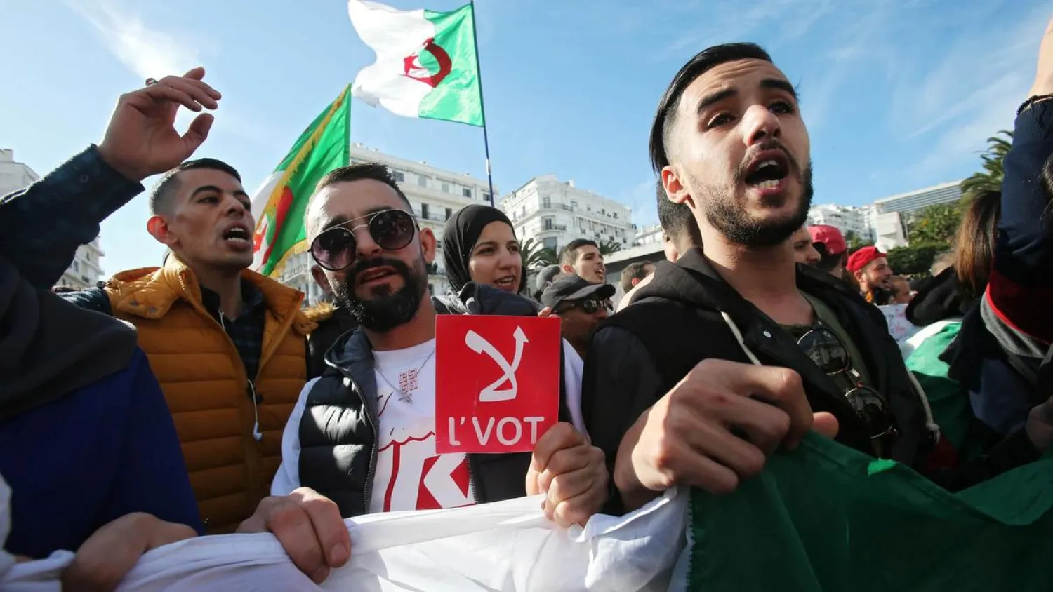 A man holds a sign reading" No vote", during a protest rejecting the presidential election in Algiers, Algeria December 11, 2019. Reuters