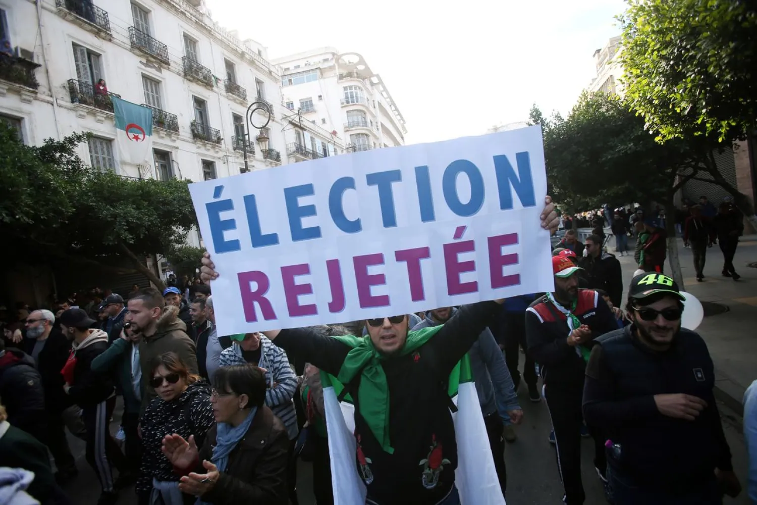Demonstrators chant slogans during a protest against presidential elections in Algeria on Thursday. (Reuters)