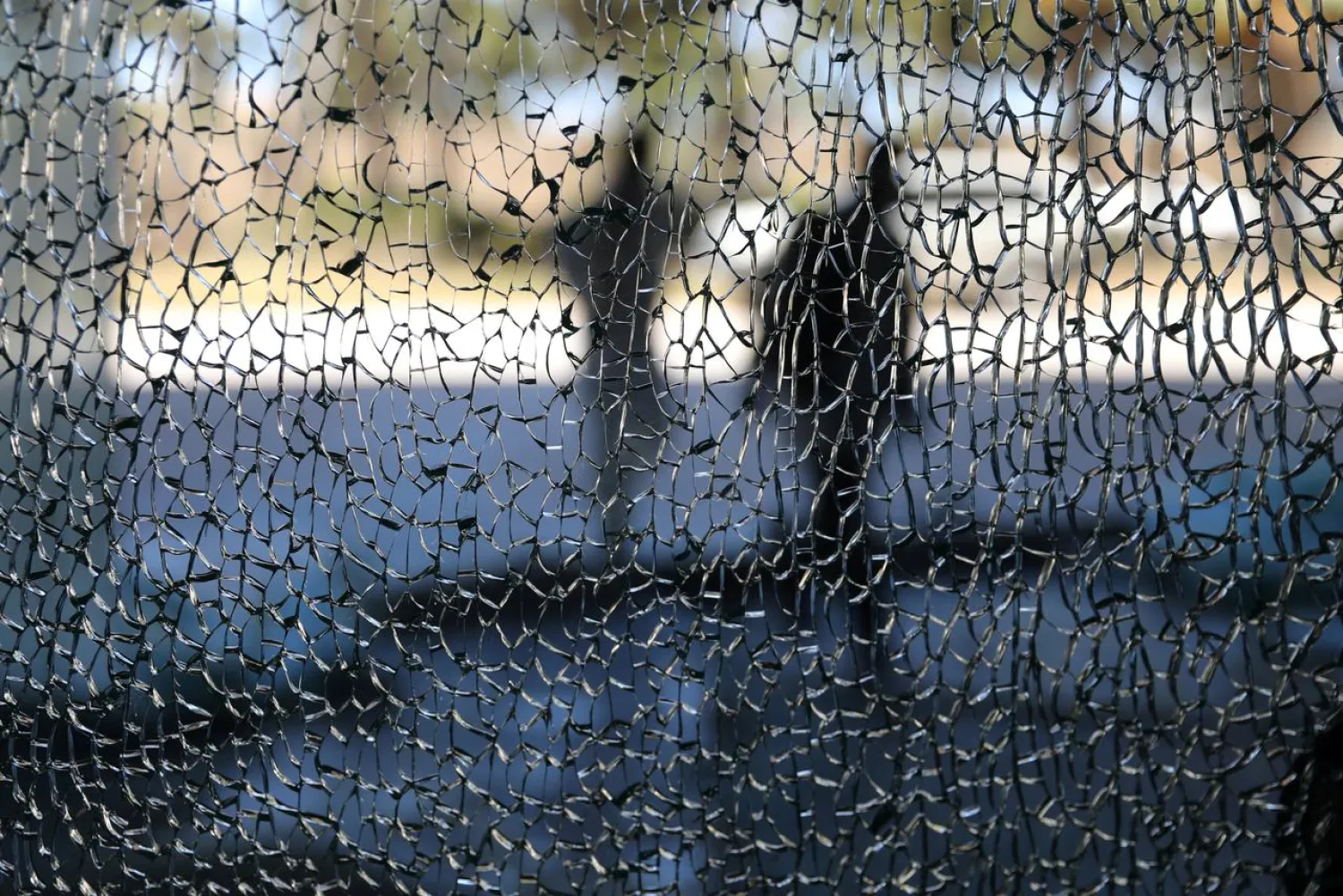 Men walk in front of Rixos hotel damaged by a rocket in Tripoli, Libya May 24, 2019. REUTERS/Goran Tomasevic/File Photo