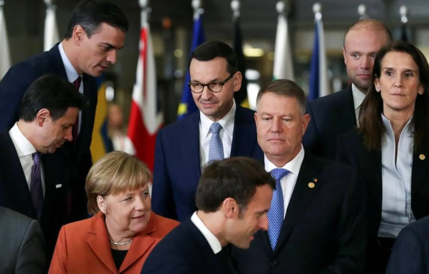 German Chancellor Angela Merkel, French President Emmanuel Macron, Romanian President Klaus Iohannis, Poland's Prime Minister Mateusz Morawiecki, Italian Prime Minister Giuseppe Conte, Spain's acting Prime Minister Pedro Sanchez, Belgium's Prime Minister Sophie Wilmes, Malta's Prime Minister Joseph Muscat attend a family photo opportunity at the European Union leaders summit in Brussels, Belgium December 12, 2019. REUTERS/Yves Herman
