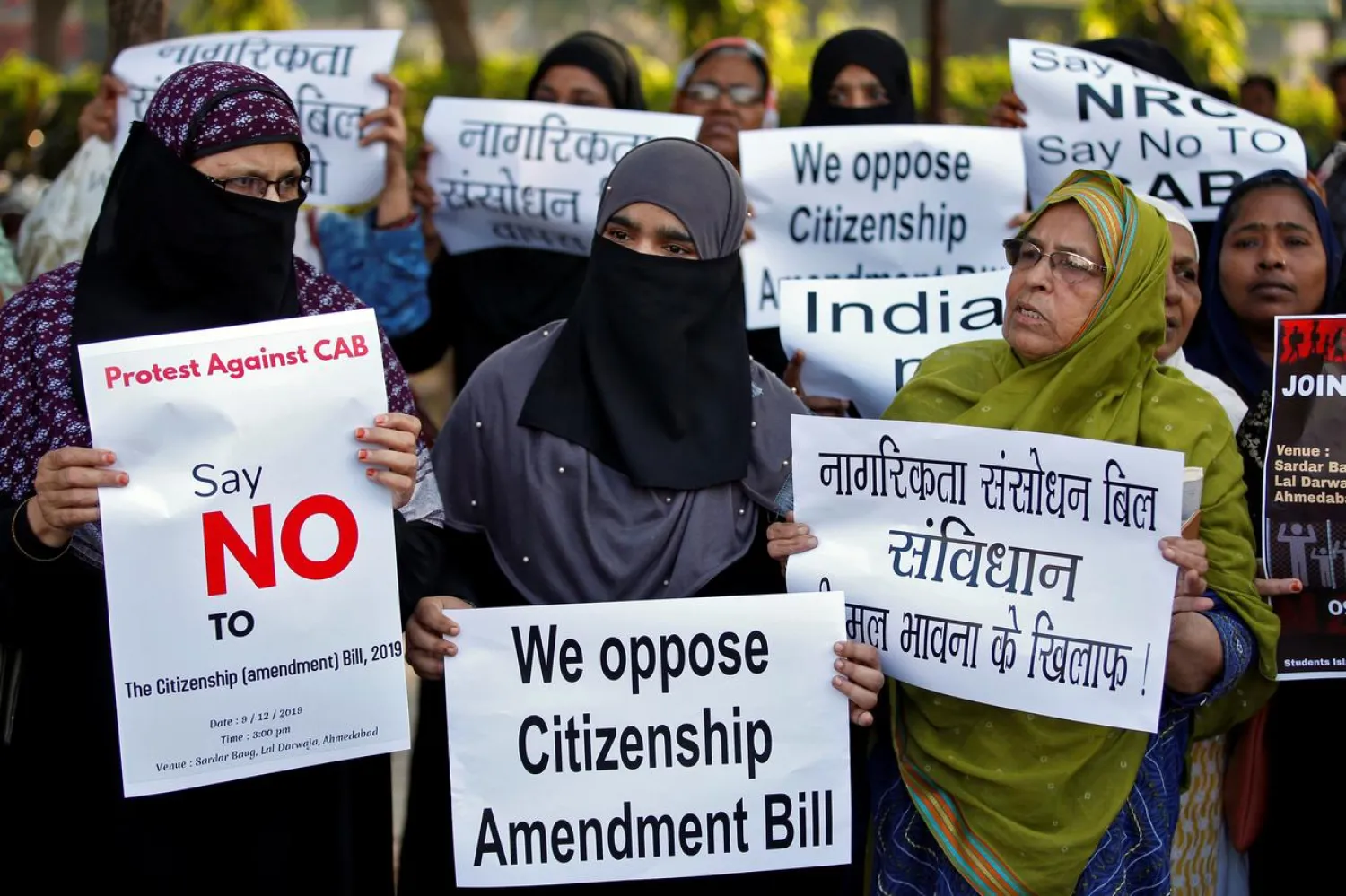 Demonstrators display placards during a protest against the Citizenship Amendment Bill, a bill that seeks to give citizenship to religious minorities persecuted in neighbouring Muslim countries, in Ahmedabad, India, December 9, 2019. REUTERS/Amit Dave