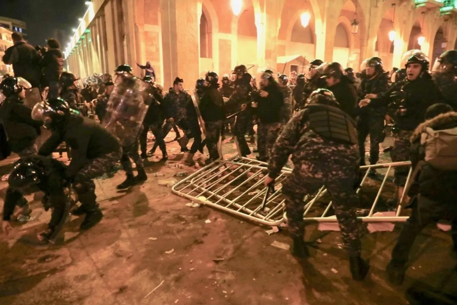 Lebanese security forces clash with protesters during an anti-government demonstration in downtown Beirut on Sunday night. (AFP)