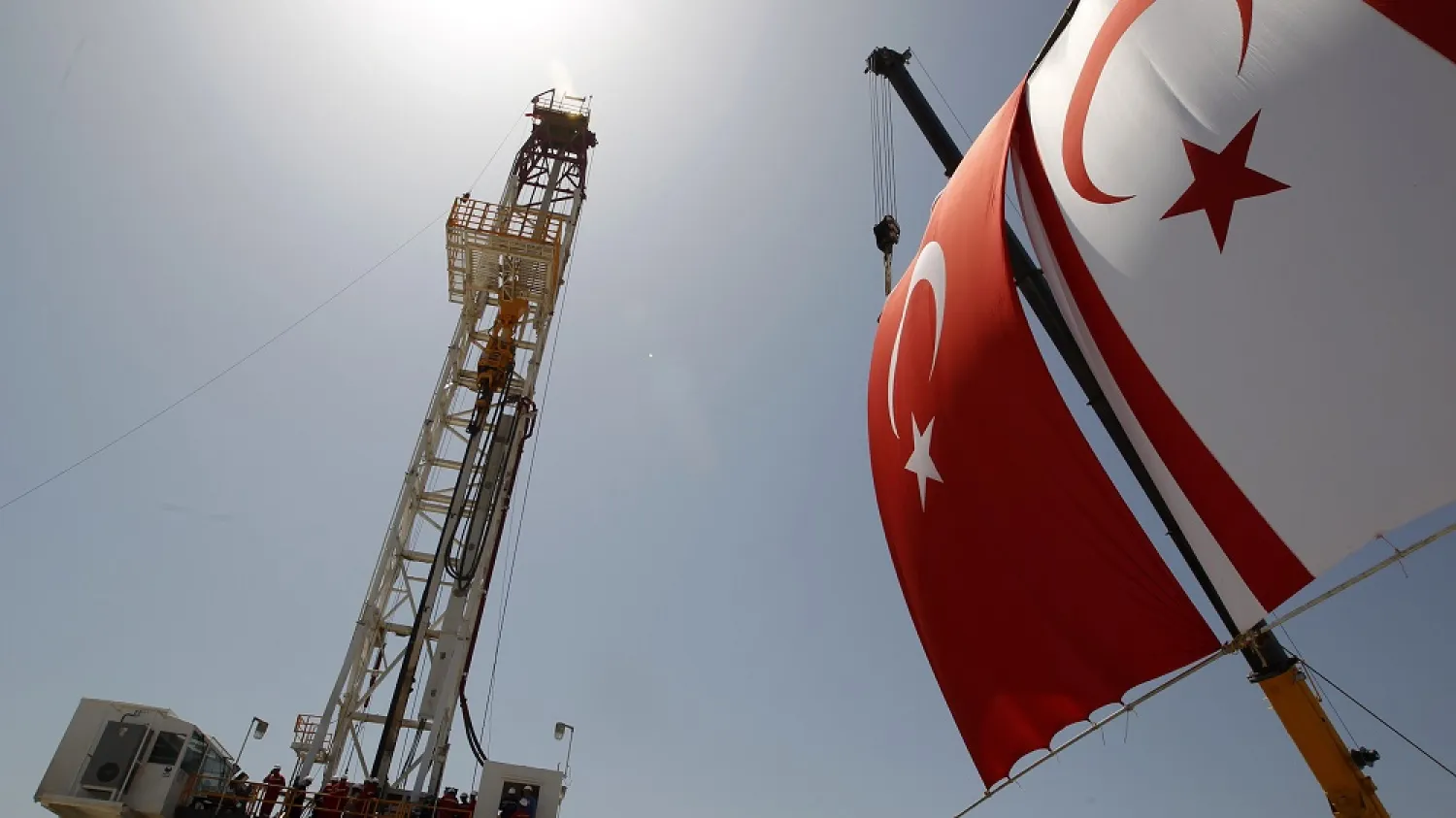 Turkish and Turkish Cypriot flags wave next to a drilling tower 25 kilometers from Famagusta, Cyprus, April 26, 2012. (Reuters)