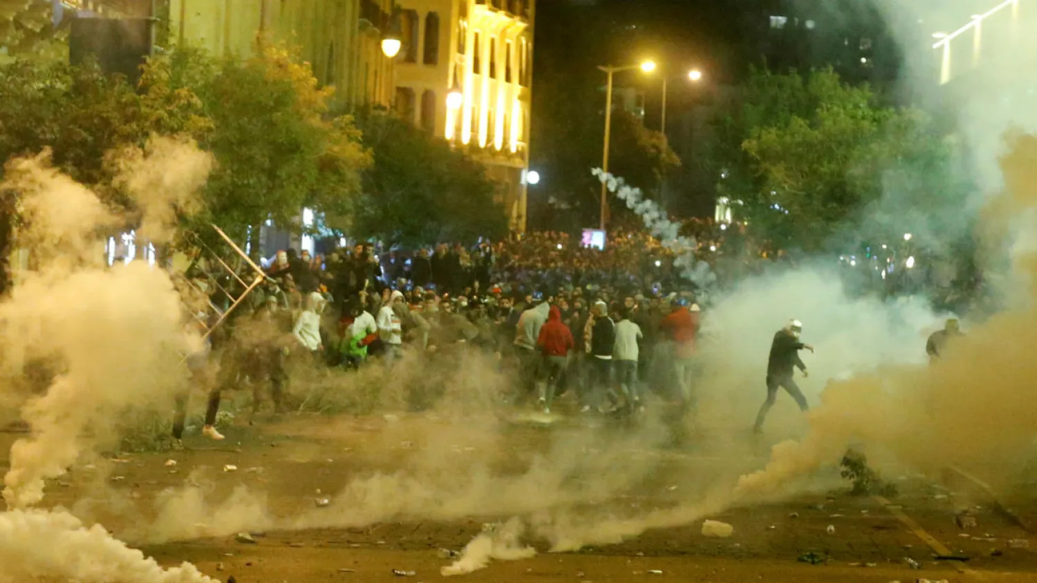 Smoke rises from tear gas during anti government protests in Beirut, Lebanon December 15, 2019. REUTERS/Mohamed Azakir