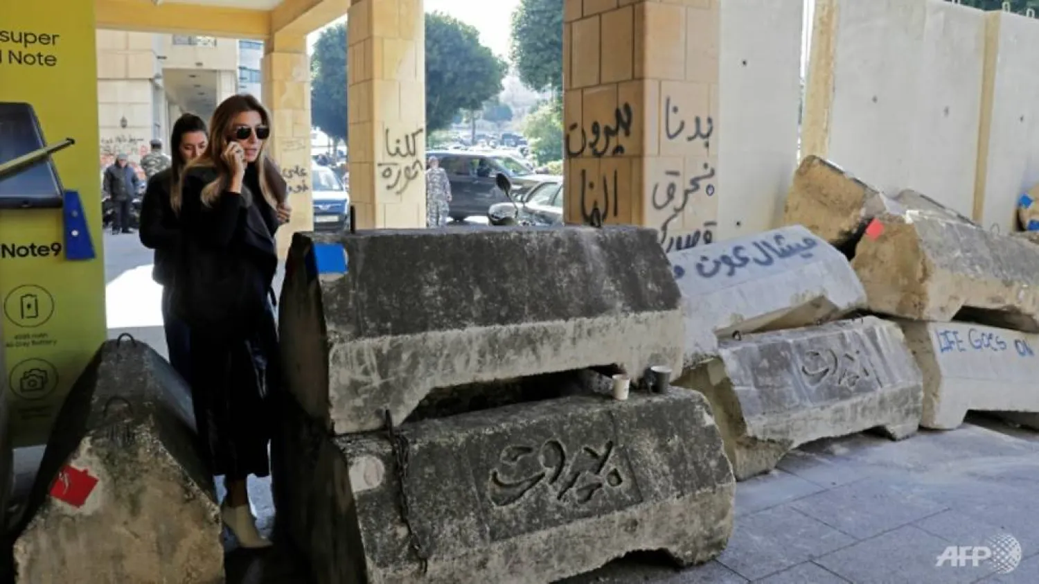 Barricades were erected in Beirut to control access to protest sites in Lebanon's capital where counterdemonstrators have attacked protesters | AFP