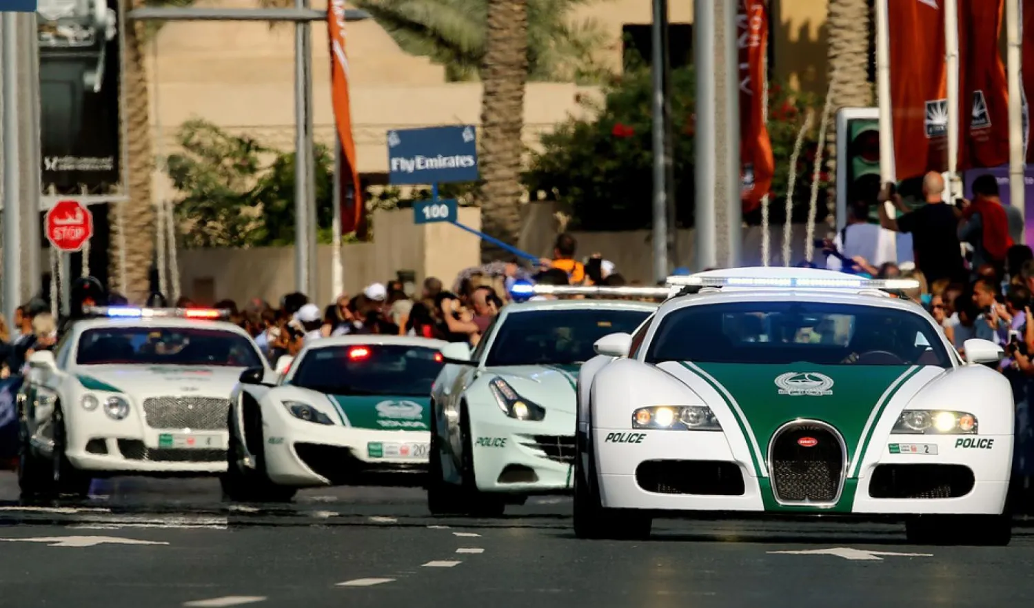A Dubai police Bugatti leads a convoy of police vehicles as they drive in downtown Dubai (AFP) 