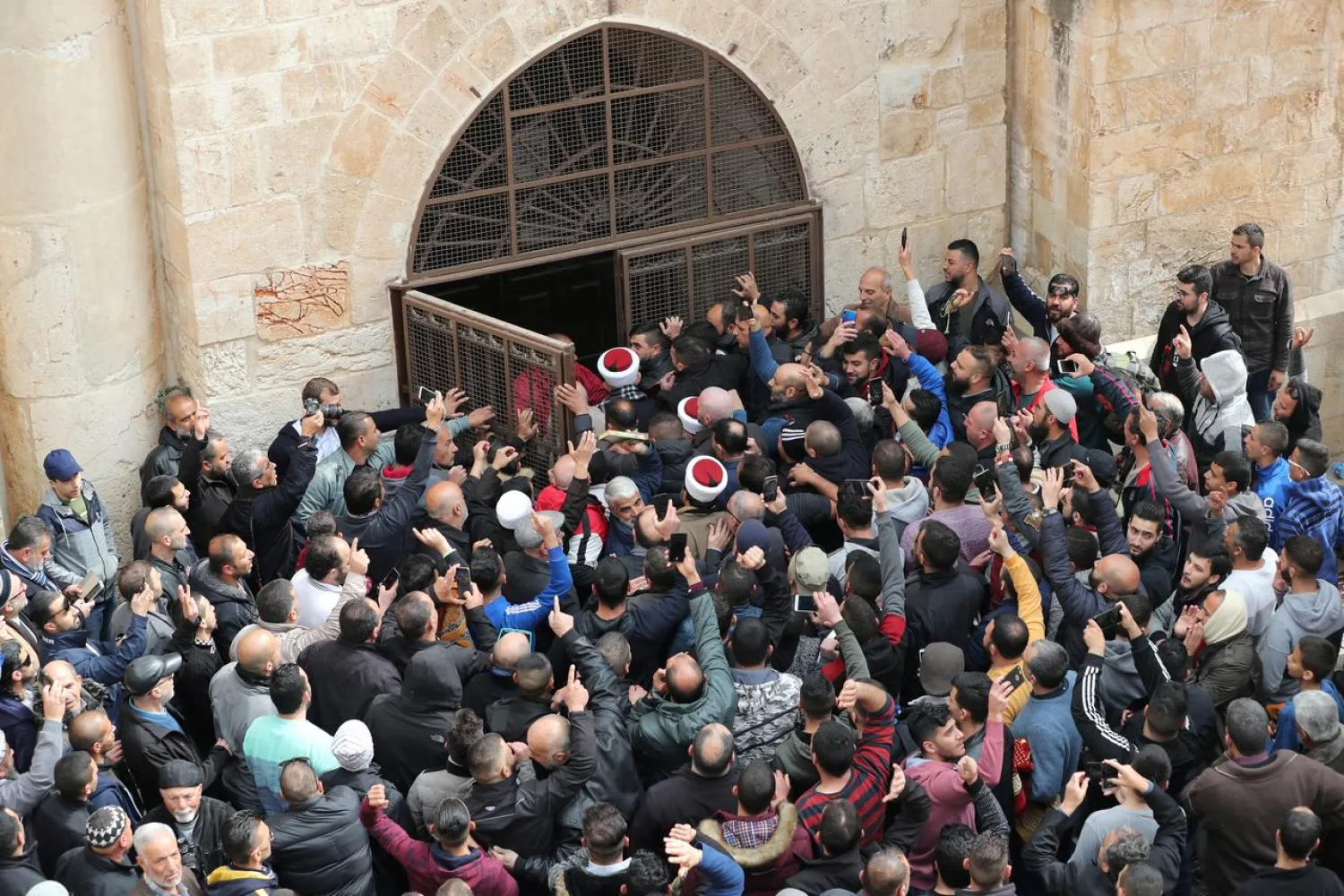 Palestinians enter the Golden Gate near Al-Aqsa mosque in Jerusalem's Old City February 22, 2019. REUTERS/Ammar Awad