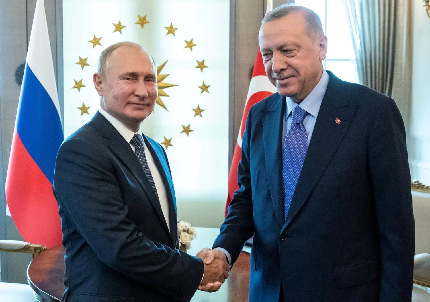 FILE PHOTO: Russian President Vladimir Putin, left, and Turkish President Recep Tayyip Erdogan shake hands during their meeting in Ankara, Turkey September 16, 2019. Pavel Golovkin/Pool via REUTERS/File Photo