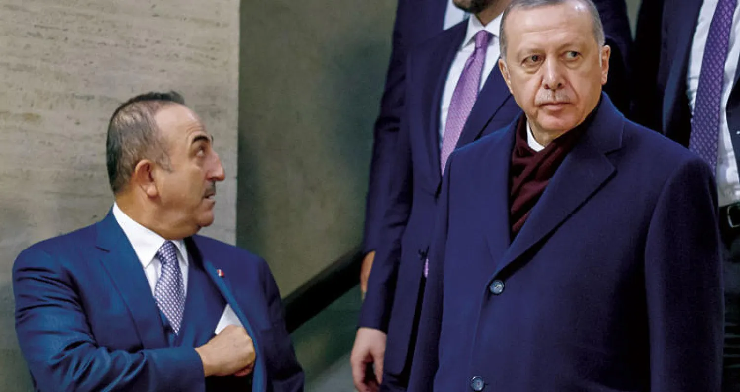 إردوغان وجاويش أوغلو على هامش قمة اللاجئين في جنيف أول من أمس (إ.ب.أ)