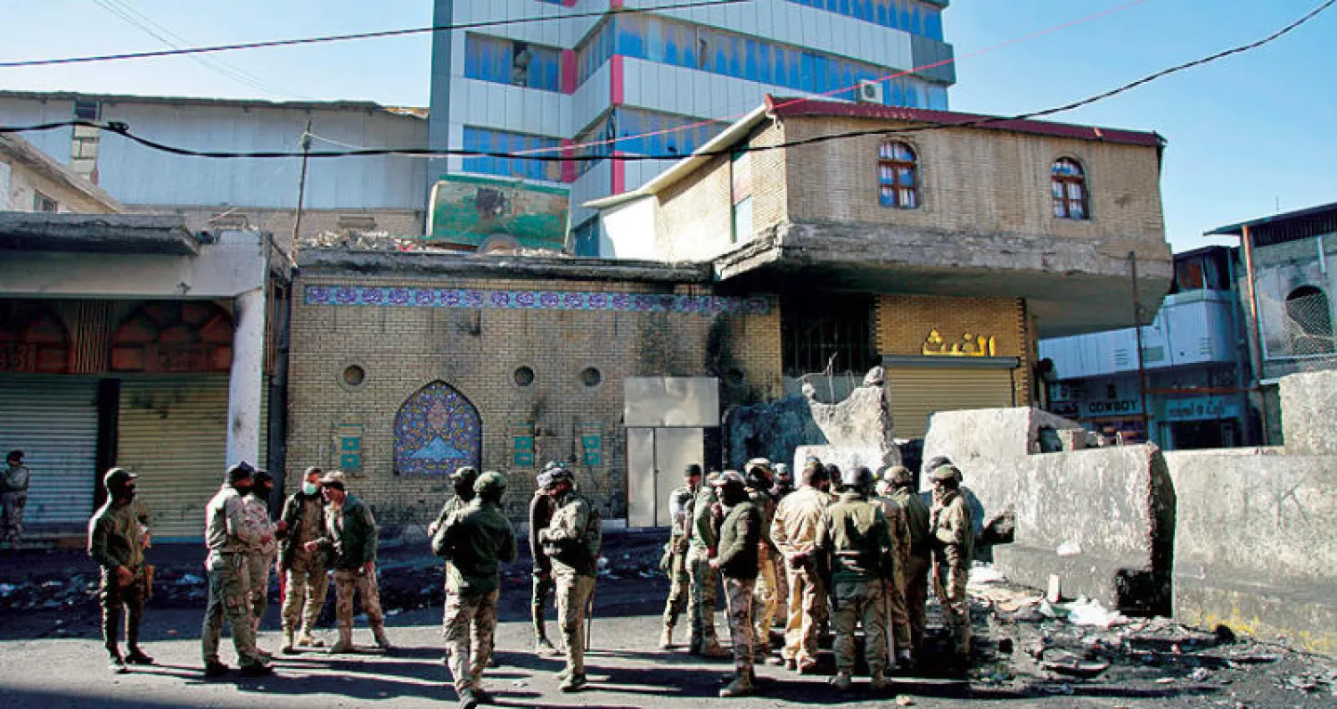 الجيش العراقي ينتشر في شارع الرشيد في بغداد بعد اشتباكات مع المحتجين (أ.ب)