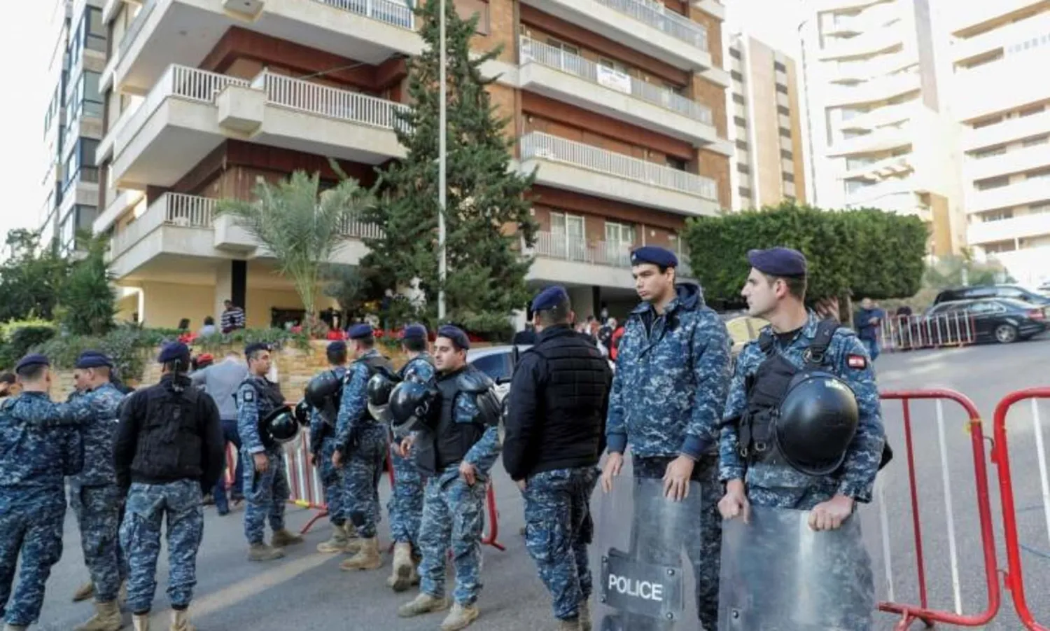 Lebanese police deploy outside the Beirut home of prime minister-designate Hassan Diab who has been holding talks on forming a new government for the protest-hit country | AFP