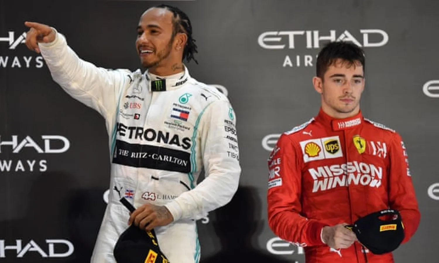  Lewis Hamilton celebrates his victory at the final race in Abu Dhabi to set the seal on his sixth F1 title as Ferrari’s Charles Leclerc looks solemn on the podium. Photograph: Andrej Isaković/AFP via Getty Images
