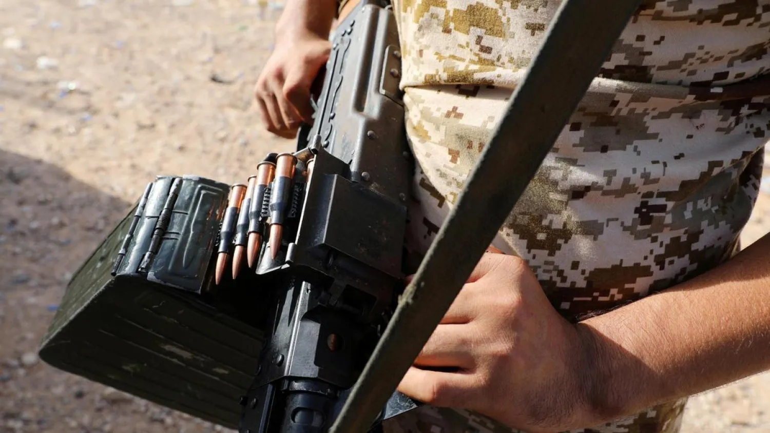 A member of Libya's GNA carries a weapon in Ain Zara, Tripoli. (Reuters)