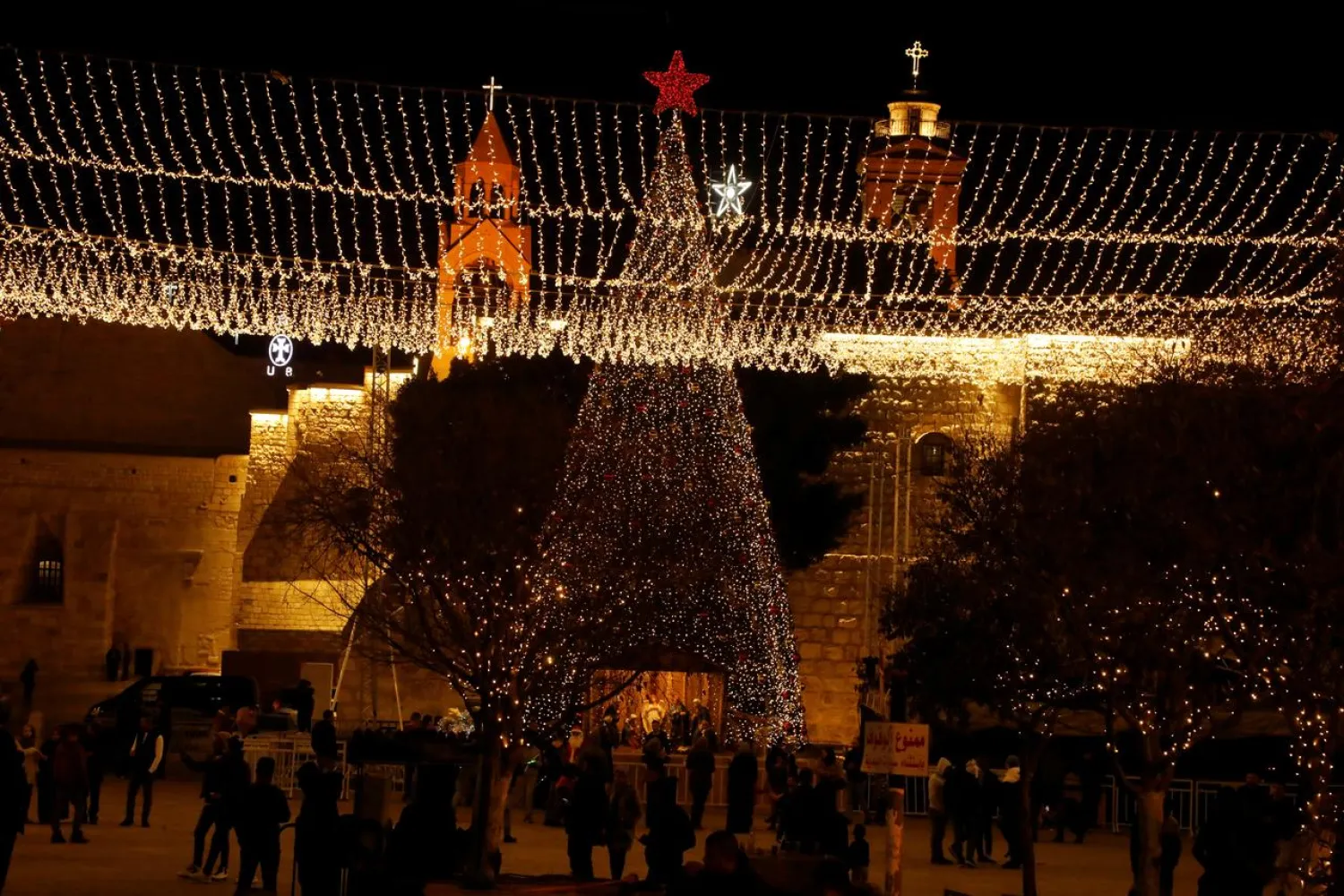 People stand at Manger Square in Bethlehem in the Israeli-occupied West Bank December 17, 2019. (Reuters)