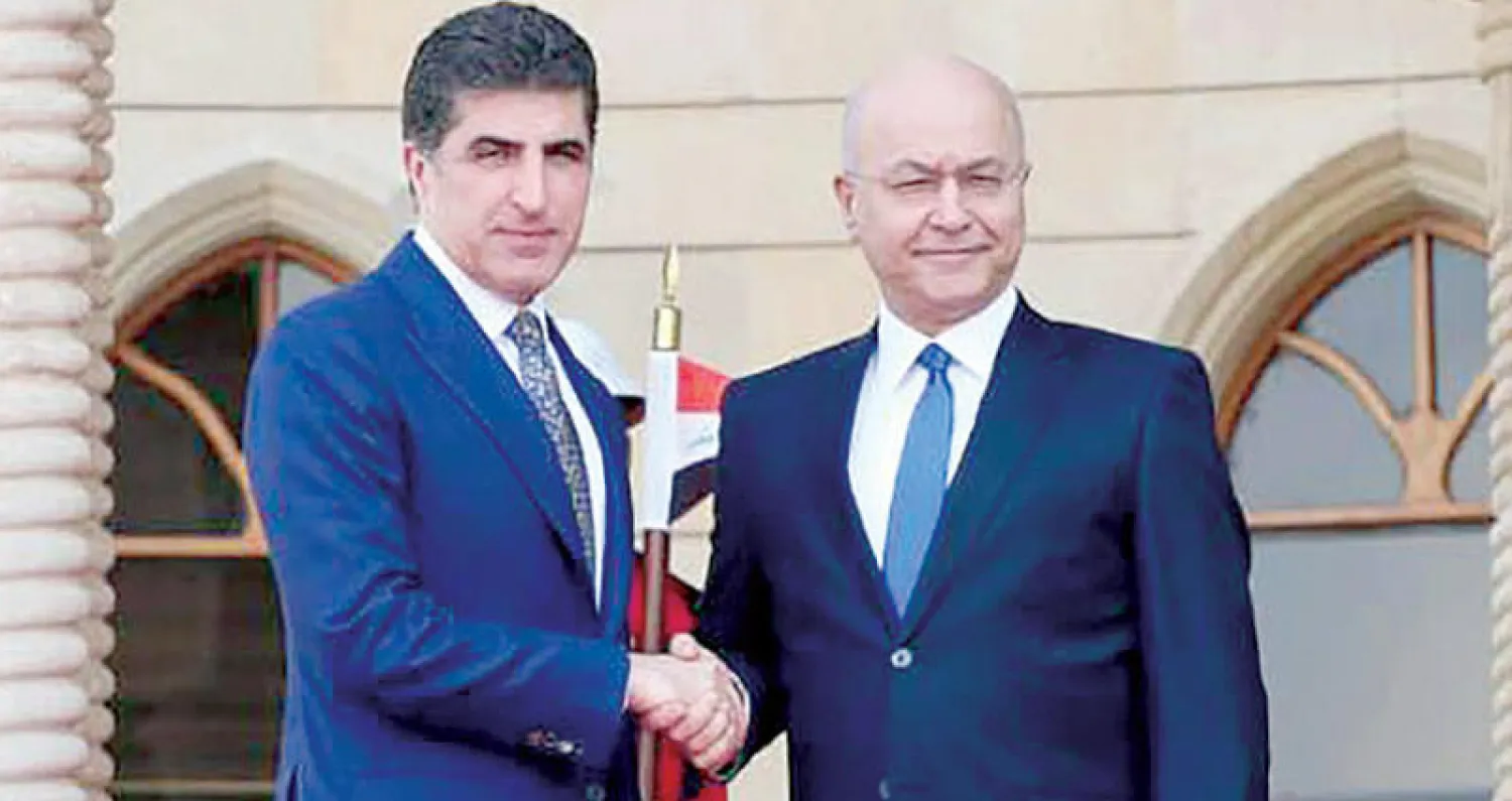 الرئيس العراقي برهم صالح مع رئيس اقليم كردستان نيجيرفان بارزاني في بغداد 13 نوفمبر (أ.ف.ب)