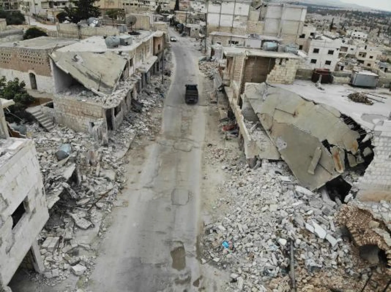 An areal view taken on October 3, 2019 shows heavy damage caused to buildinsg as a result of reported ongoing shelling and airstrikes by pro-government forces on the village of Kafr Nabl, in Syria's southern Idlib province. AFP