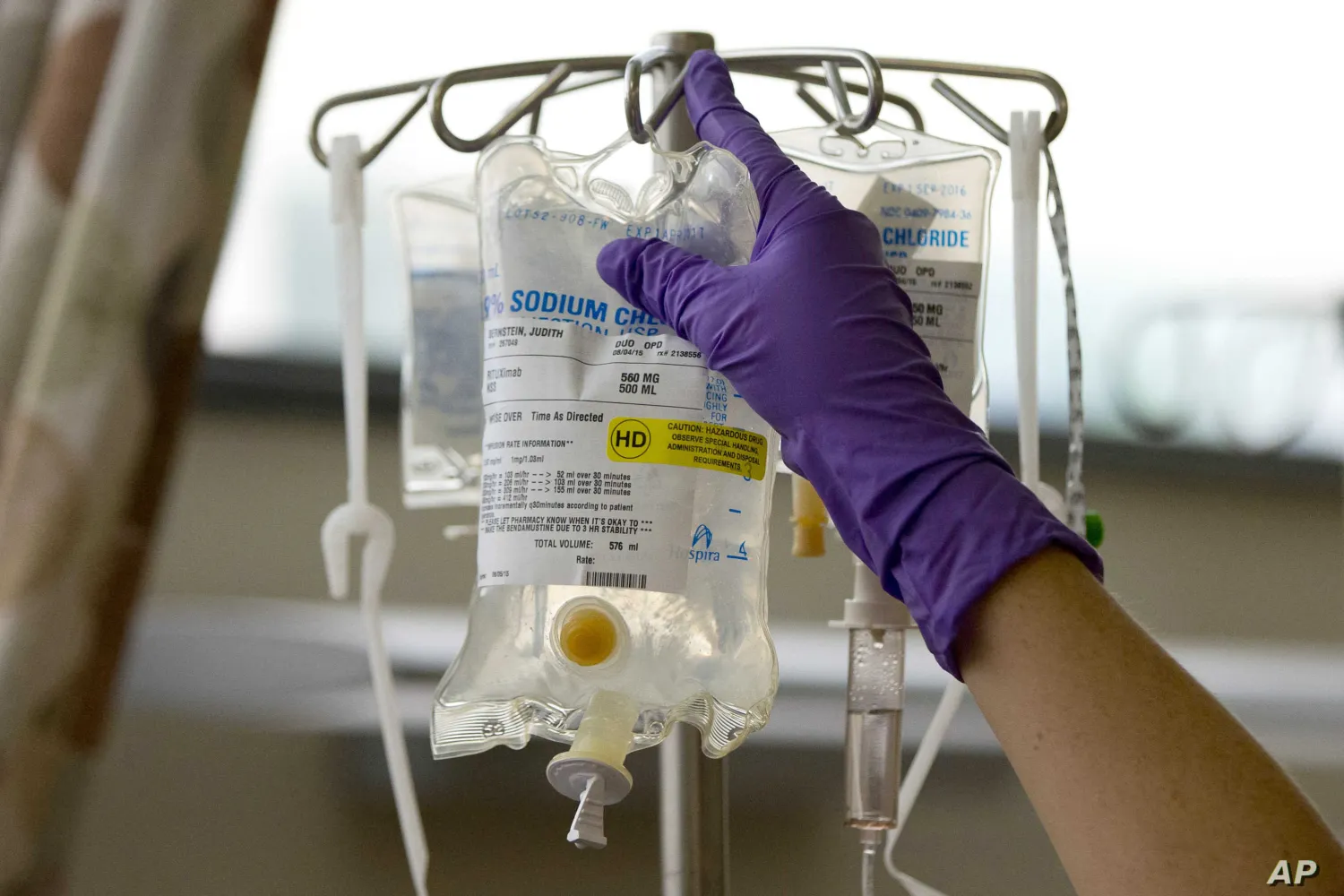 File- A nurse places chemotherapy medication on an intravenous
stand at the Fox Chase Cancer Center in Philadelphia. AP.