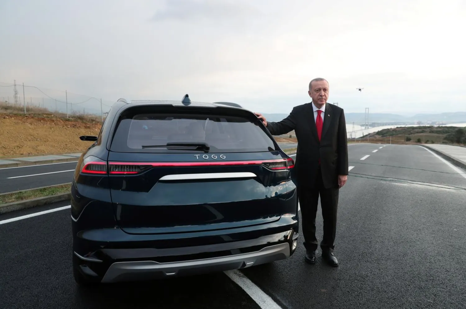 Turkish President Erdogan poses with a prototype of the domestic electric car project in Gebze, Turkey, December 27, 2019. (Reuters)