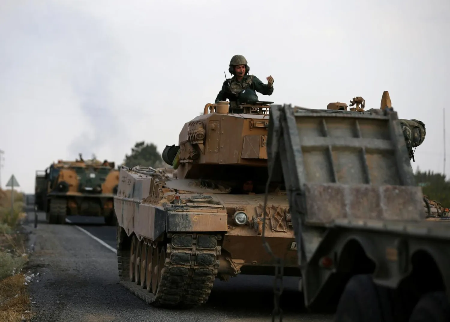 FILE PHOTO: Turkish army vehicles are moving on a road near the Turkish border town of Ceylanpinar, Sanliurfa province, Turkey, October 18, 2019. REUTERS/Stoyan Nenov/File Photo
