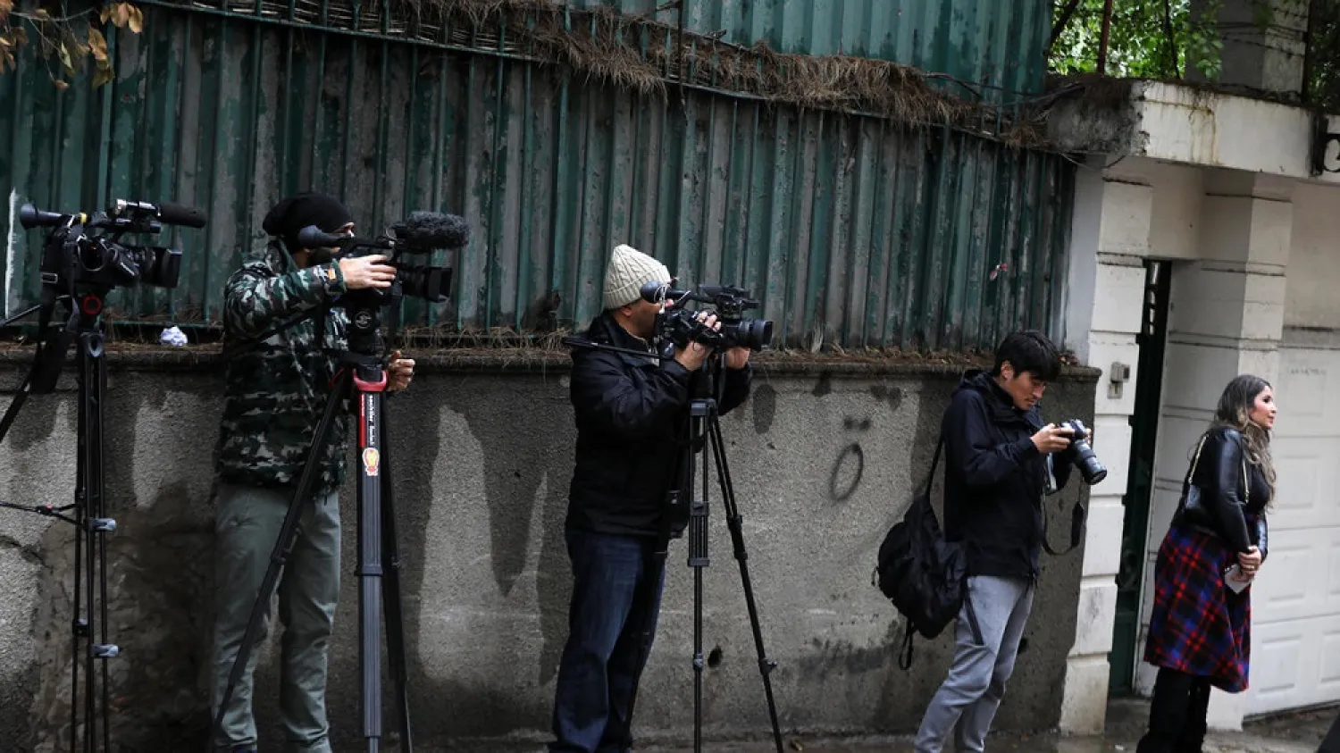 Members of the media wait in front of a house identified by court documents as belonging to former Nissan chief Carlos Ghosn in a wealthy neighborhood of the Lebanese capital Beirut. (AFP)