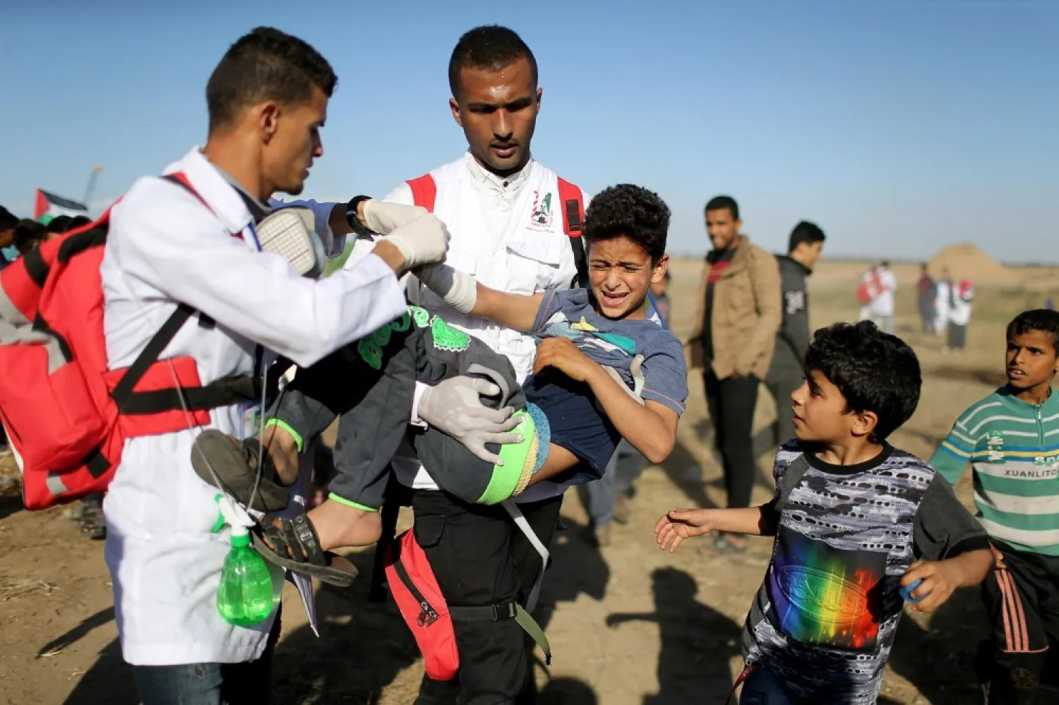 A wounded Palestinian boy is evacuated during a protest at the Israel-Gaza border fence, in the southern Gaza Strip May 3, 2019. (Reuters)