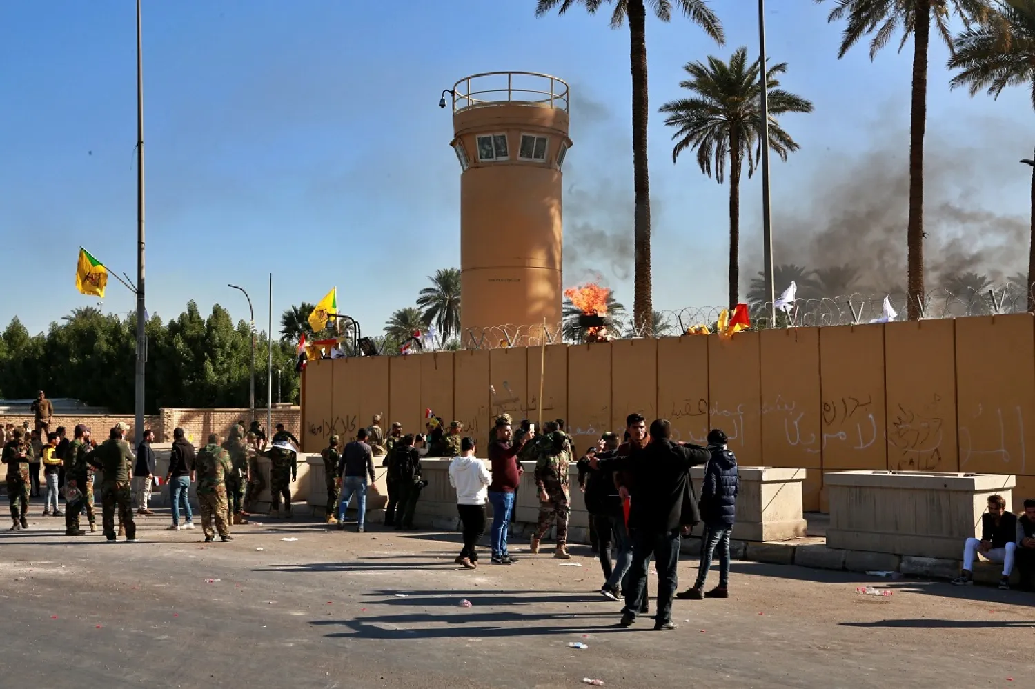 Protesters gather in front of the US embassy compound, in Baghdad, Iraq, Tuesday, Dec. 31, 2019. (AP)