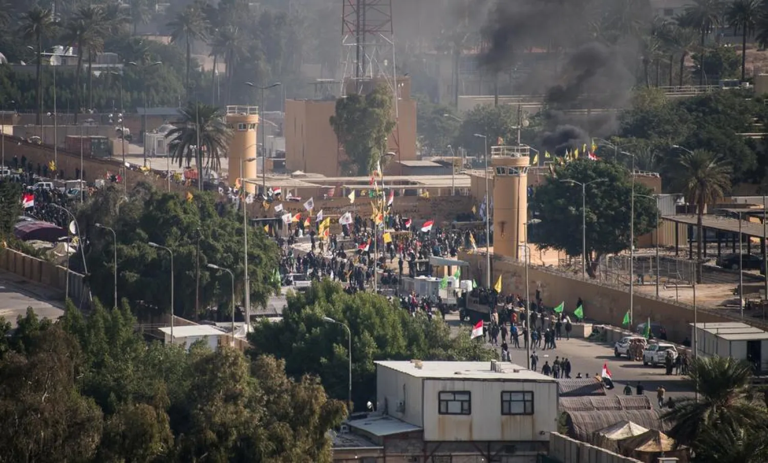 Iraqi security forces deploy during the second day of protests at the US embassy in Baghdad (Handout via Reuters)