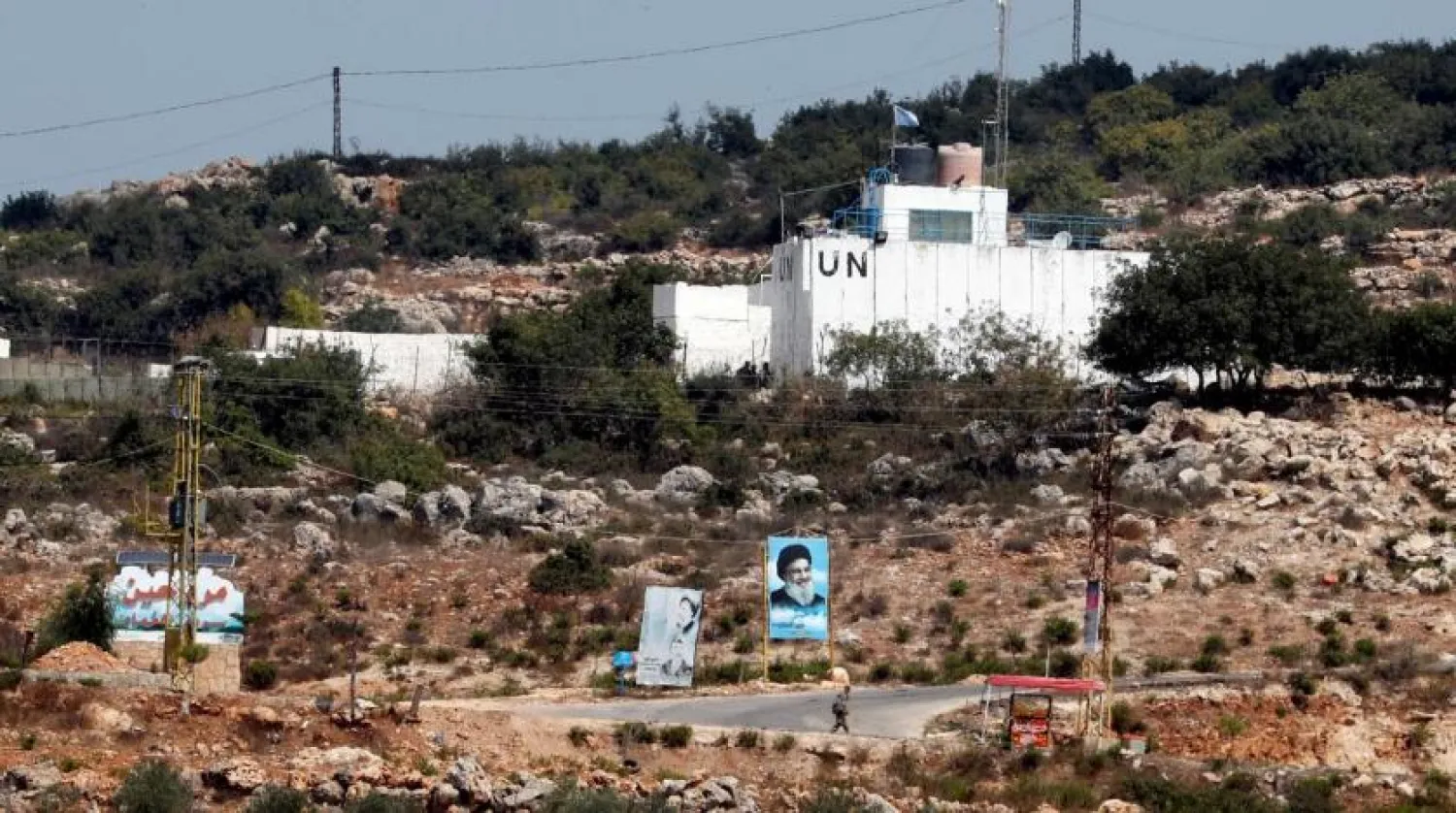 A banner depicting Hezbollah leader Hassan Nasrallah and a UN post are seen in Lebanon on August 28, 2019. (Reuters)