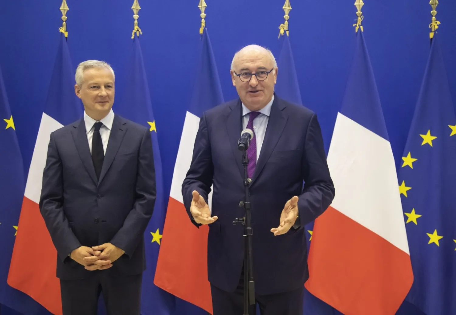 French Finance Minister Bruno Le Maire, left, and European Trade Commissioner Phil Hogan attend a media conference after their meeting in Paris, Tuesday, Jan. 7, 2020. (AP Photo/Michel Euler)