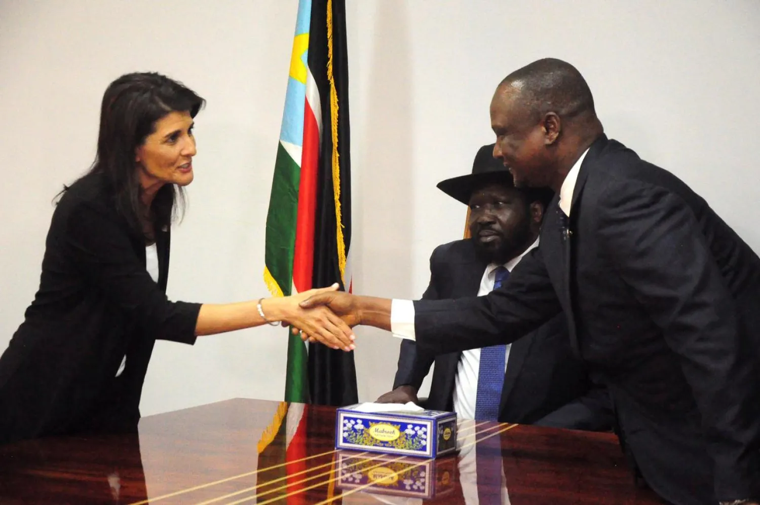 FILE PHOTO: U.S. Ambassador to the United Nations Nikki Haley greets South Sudan's First Vice President Taban Deng Gai next to South Sudan President Salva Kiir, in Juba, South Sudan October 25, 2017. REUTERS/Jok Solomun/File Photo
