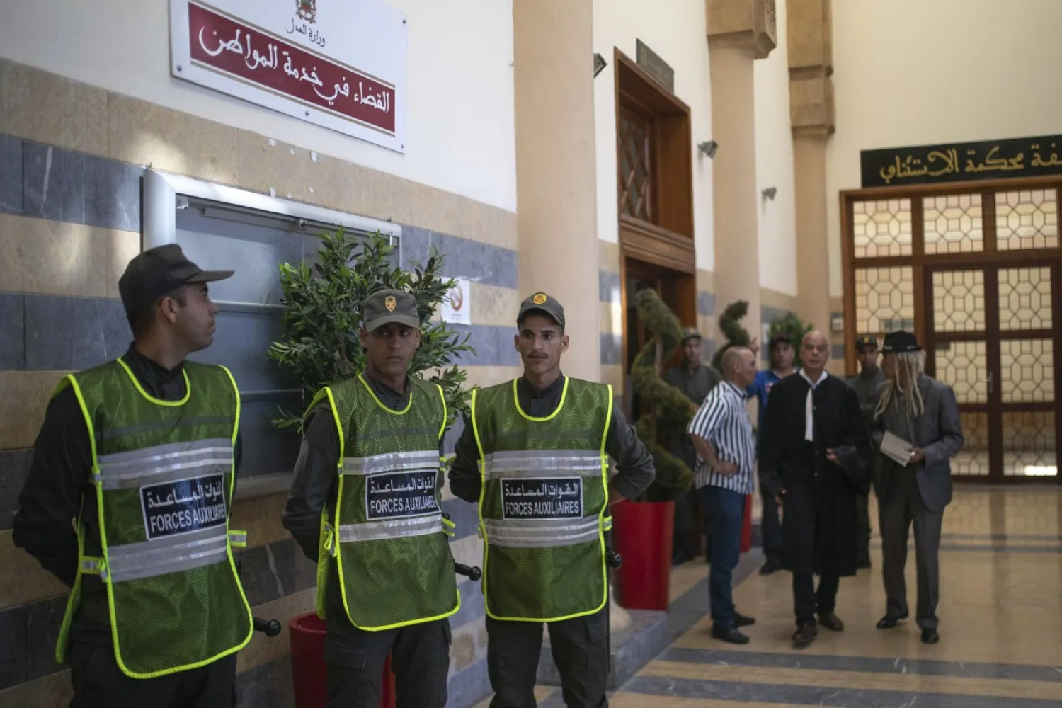 Security forces stand guard outside a courtroom near Rabat, Morocco, Thursday, July 18, 2019. (AP Photo/Mosa'ab Elshamy)
