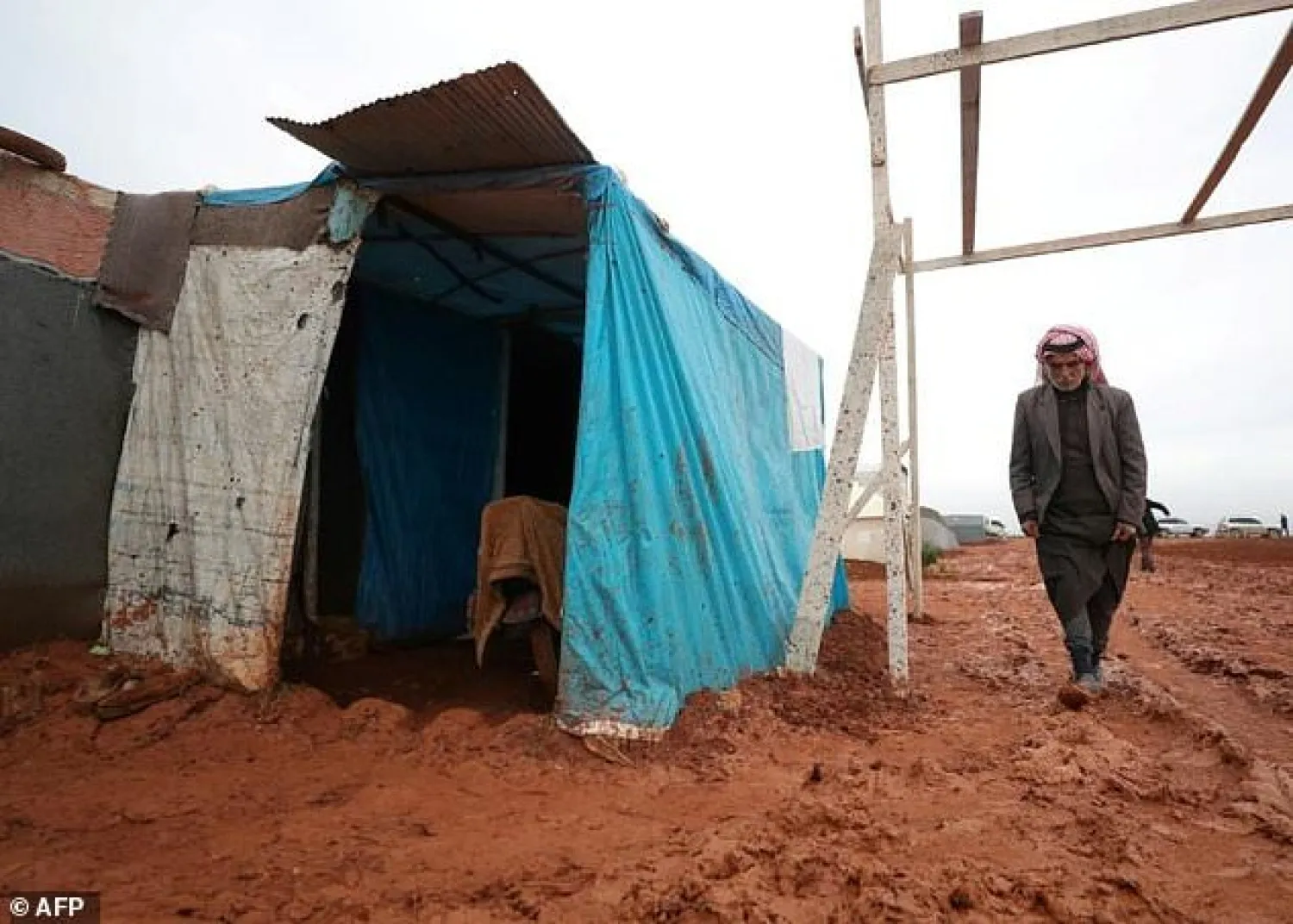 An elderly Syrian man by his tent in a camp for displaced people in northern Syria: Russia and the West are in a struggle at the UN over the renewal of humanitarian aid to millions of such people. AFP

