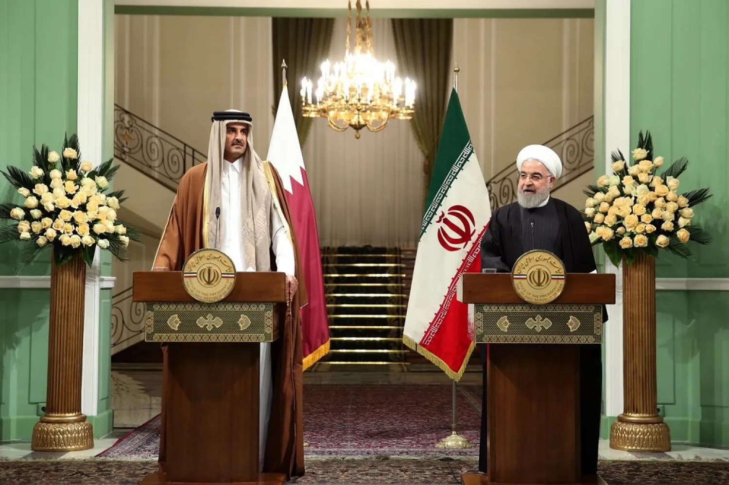 Iranian President Hassan Rouhani (R) speaks during a news conference with Emir of Qatar Sheikh Tamim bin Hamad al-Thani, in Tehran, Iran January 12, 2020. (Reuters)