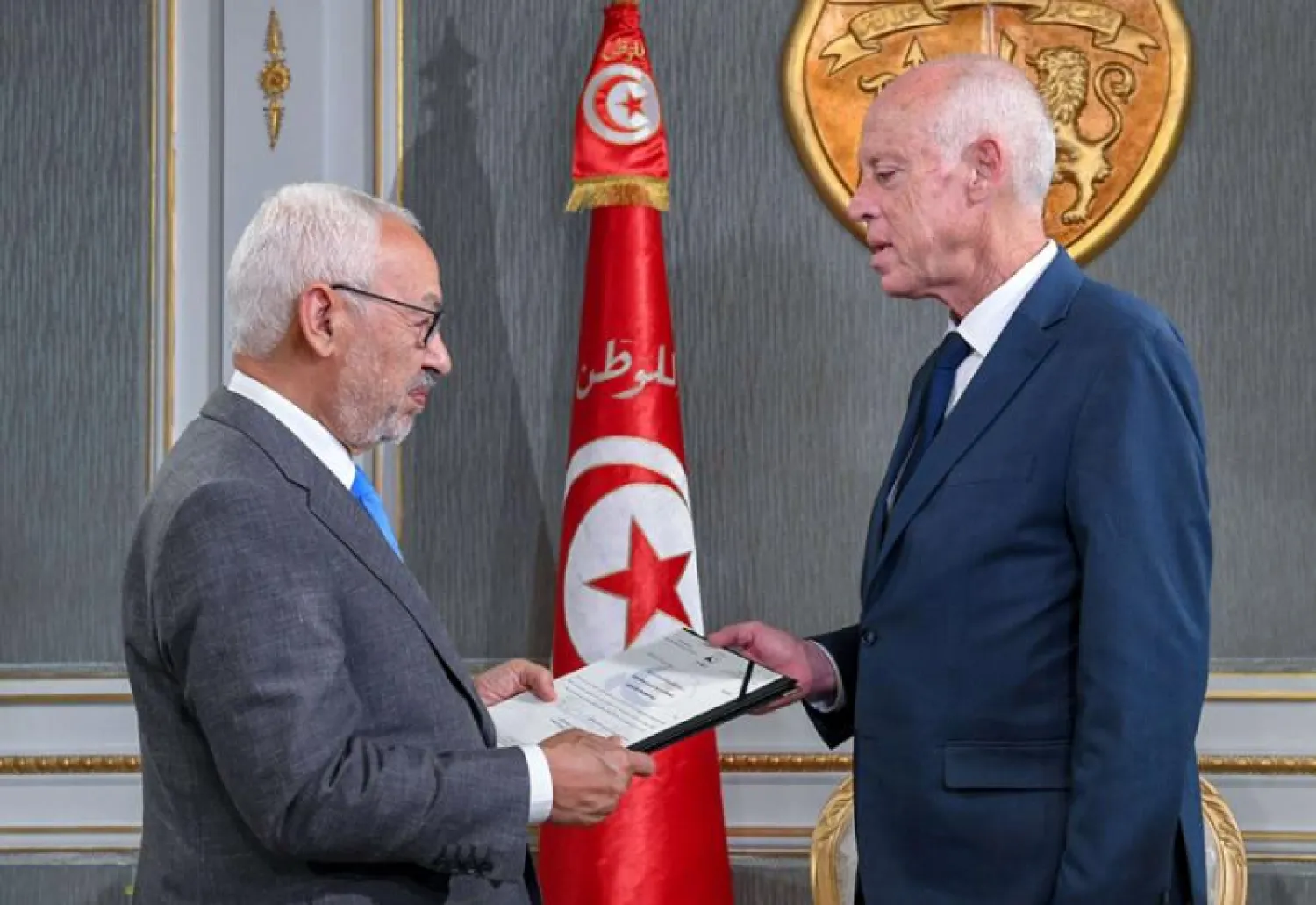 Tunisia's President Kais Saied receives Ennahdha leader and parliament speaker Rached Ghannouchi at the presidential palace in Tunis, November 15. (Tunisian Presidency via AFP)