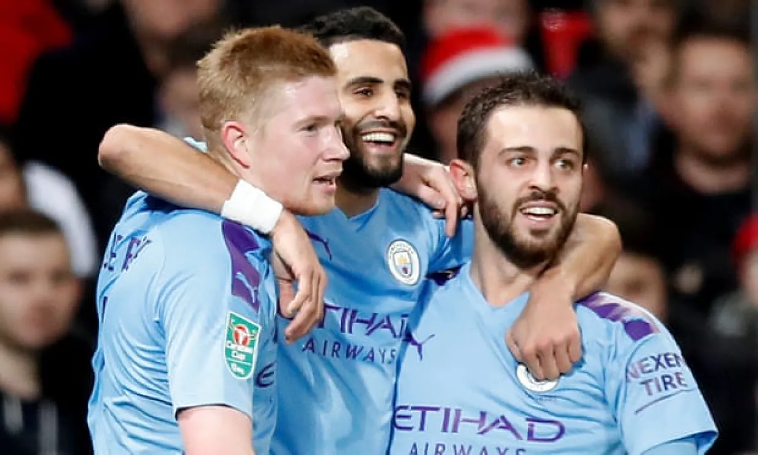  Kevin de Bruyne, Riyad Mahrez and Bernardo Silva celebrate going 2-0 up at Manchester United during a first half in which City overwhelmed their rivals in a blur of a thousand midfielders. Photograph: Martin Rickett/PA
